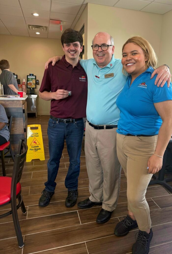 Brett Callahan, Robert Murphy & Autumn Peoni celebrating the grand opening of a new restaurant.